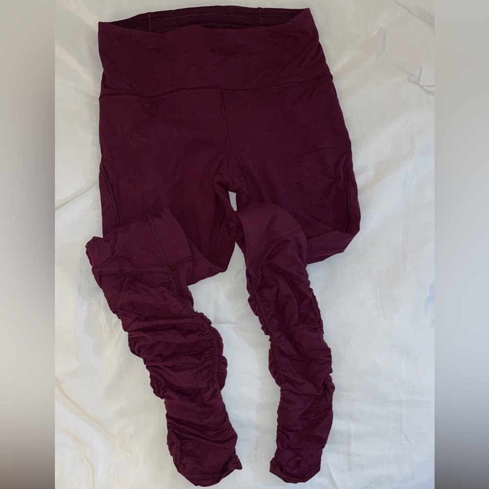 Lululemon full length burgundy leggings with ruching at the bottom